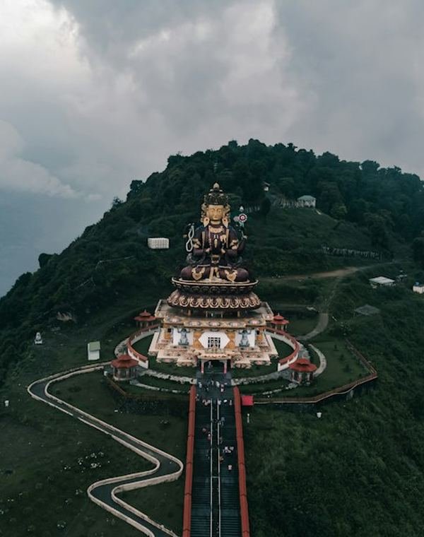 Hilltop statue and winding road near Pelling, West Sikkim