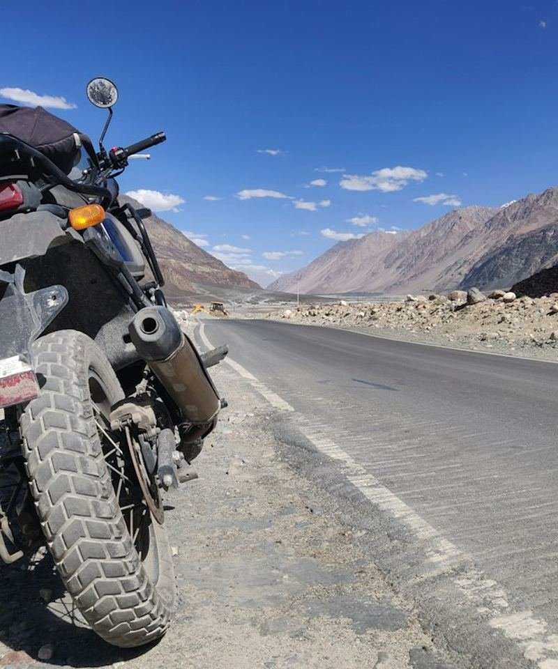Motorcycle parked on a Himalayan mountain highway